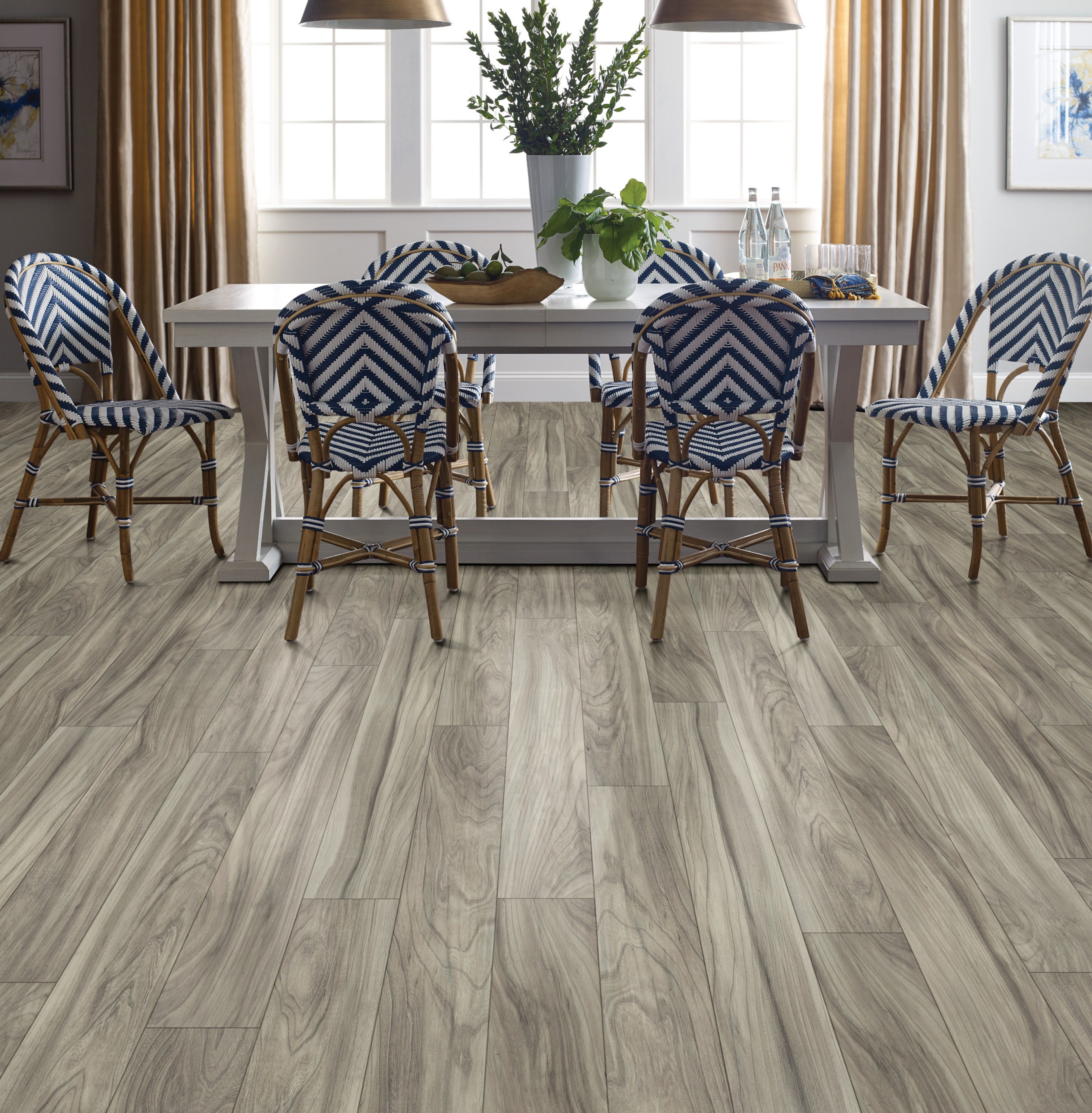 Dining room with wood-look laminate flooring from Wholesale Flooring and Blinds in Casper, WY